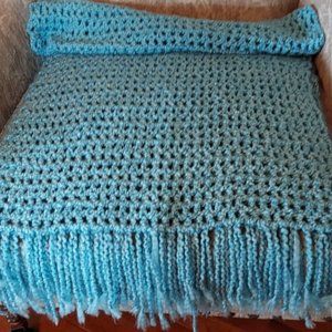 This is a hand made crochet blue shawl/thow/wrap. It is in perfect condition